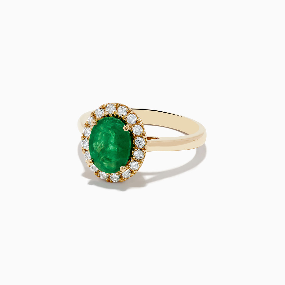 The 14K Yellow Gold Emerald and Diamond Ring features an oval green emerald center stone encircled by a halo of small round white diamonds, shown against a white background.