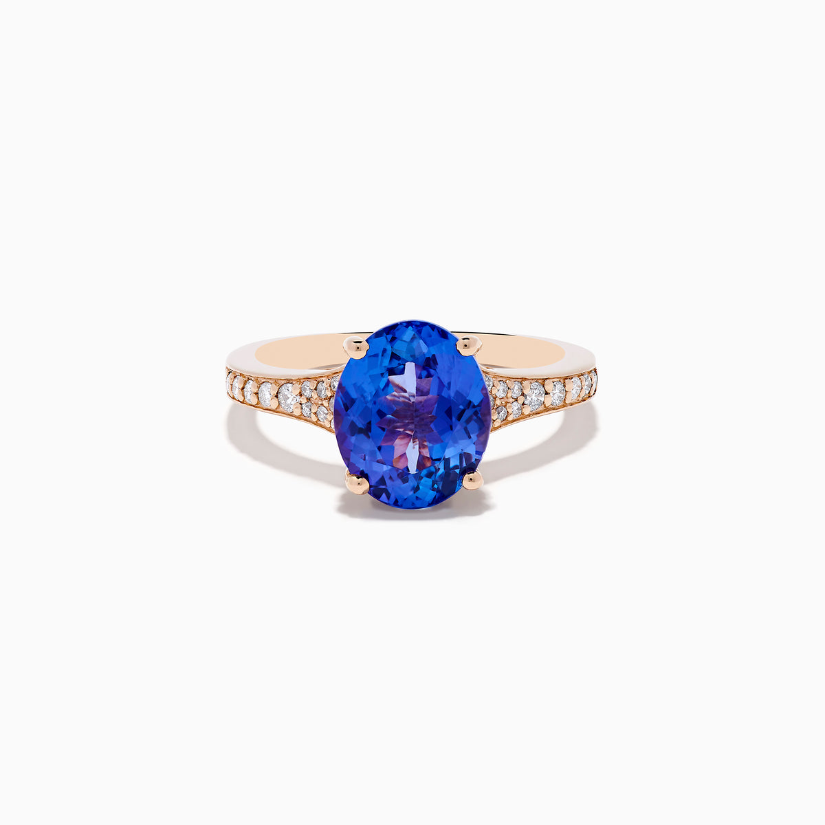 The Nahla 14K Rose Gold Tanzanite and Diamond Ring showcases an oval-cut blue tanzanite centerpiece accented by round diamonds on the band, set against a white background.