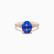 The Nahla 14K Rose Gold Tanzanite and Diamond Ring showcases an oval-cut blue tanzanite centerpiece accented by round diamonds on the band, set against a white background.