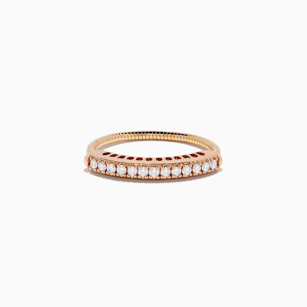 The 14K Rose Gold Flexible Size 7-10 Diamond Ring showcases a row of small, round white diamonds along the band and is shown on a plain white background. Adjustable fit ensures comfort for any occasion.