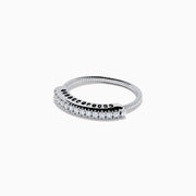 The 14K White Gold Flexible Size 7-10 Diamond Ring features a row of small round diamonds along the top and is displayed on a plain white background.