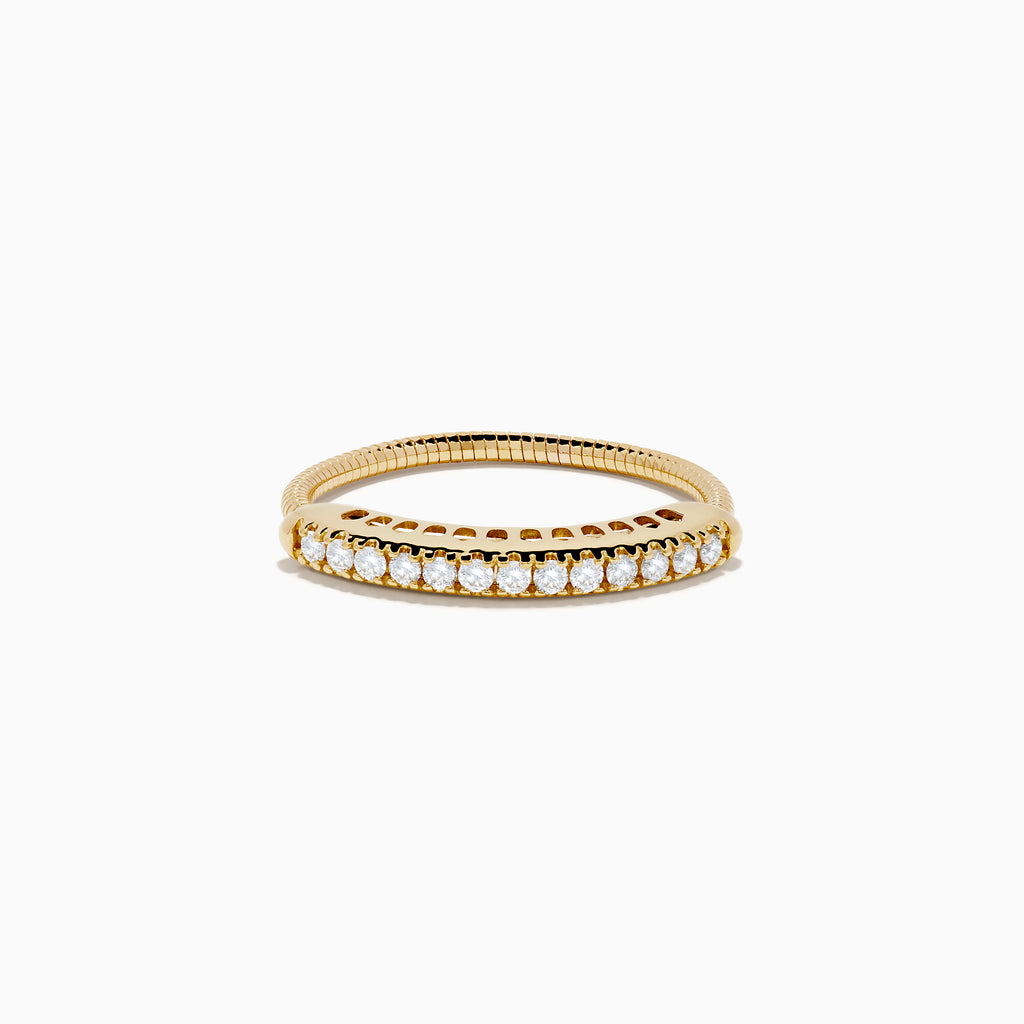 The 14K Yellow Gold Flexible Size 7-10 Diamond Ring showcases a row of round white diamonds set along the top half on a plain white background, with an adjustable fit for comfort.