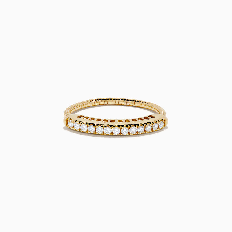 The 14K Yellow Gold Flexible Size 7-10 Diamond Ring showcases a row of round white diamonds set along the top half on a plain white background, with an adjustable fit for comfort.
