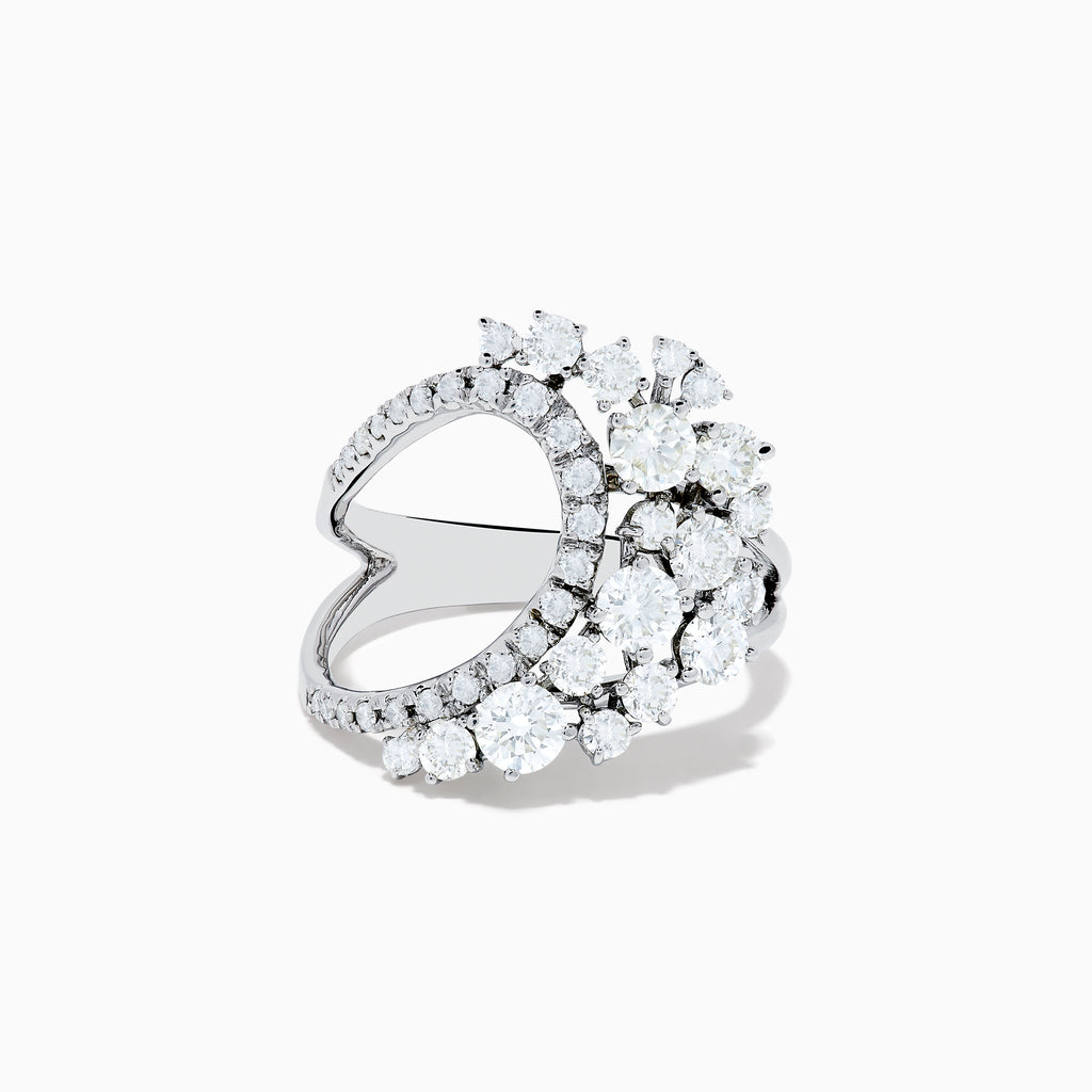 The 14K White Gold Diamond Wave Ring features an open curved design with clusters of round diamonds and marquise-shaped stones, set against a plain white background.