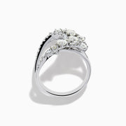 The 14K White Gold Diamond Wave Ring features an open curved design with clusters of round diamonds and marquise-shaped stones, set against a plain white background.