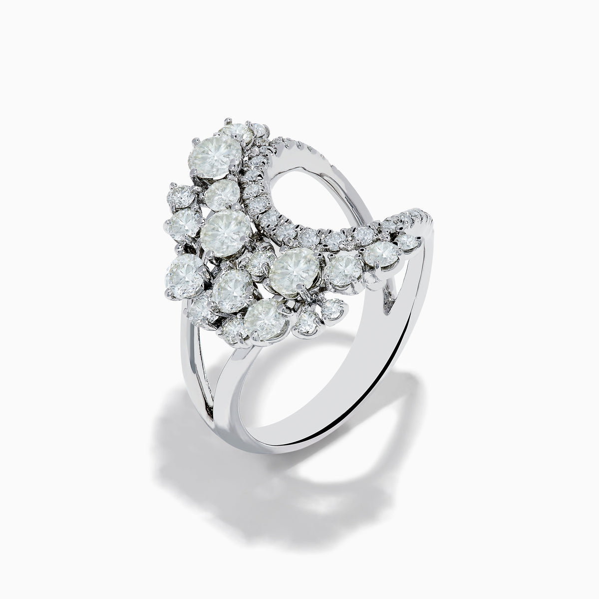 The 14K White Gold Diamond Wave Ring features an open curved design with clusters of round diamonds and marquise-shaped stones, set against a plain white background.