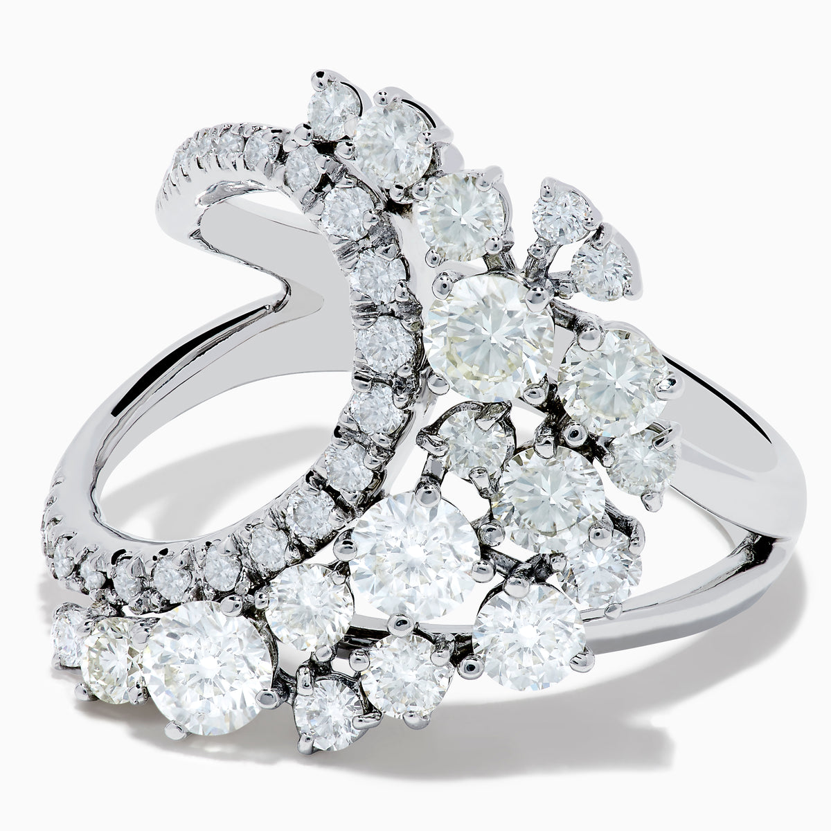 The 14K White Gold Diamond Wave Ring features an open curved design with clusters of round diamonds and marquise-shaped stones, set against a plain white background.