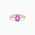 The 14K Rose Gold Pink Sapphire and Diamond Solitaire Ring features a rectangular pink sapphire centerpiece and small round diamonds on the band, shown against a white background.