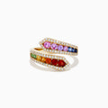The Watercolors 14K Yellow Gold Multi Color Sapphire and Diamond Bypass Ring showcases a wrap-around design with rainbow sapphires in two rows, bordered by sparkling clear diamonds on both edges, set against a white background.