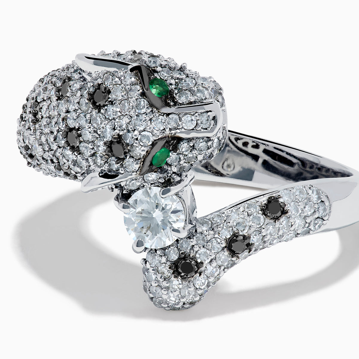 The Signature 14K White Gold Diamond Bypass Panther Ring features white and black diamond clusters, two green gemstone eyes, and a large central diamond set in the panther’s mouth.