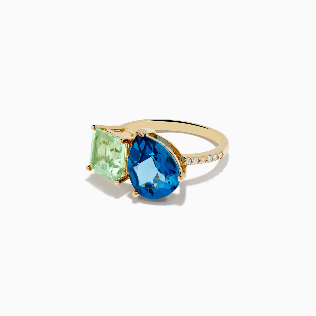 The 14K Yellow Gold Diamond Green Amethyst London Blue Topaz Toi Et Moi Ring showcases a square-cut Green Amethyst and a pear-shaped London Blue Topaz side by side, accented with sparkling Diamonds along the band.