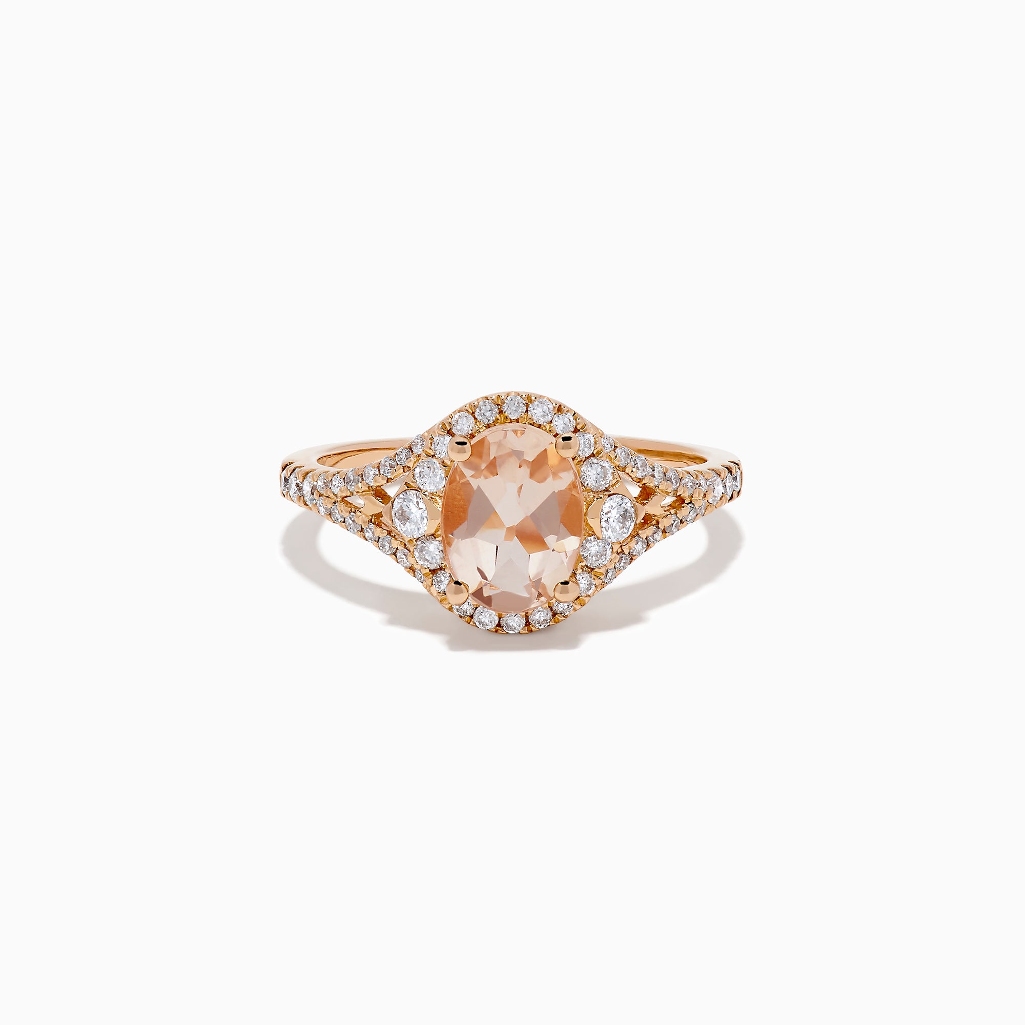 The Rose Gold Morganite and Diamond Split Halo Ring showcases an oval peach-colored Morganite center, encircled by a sparkling diamond split halo with additional diamonds along the band.