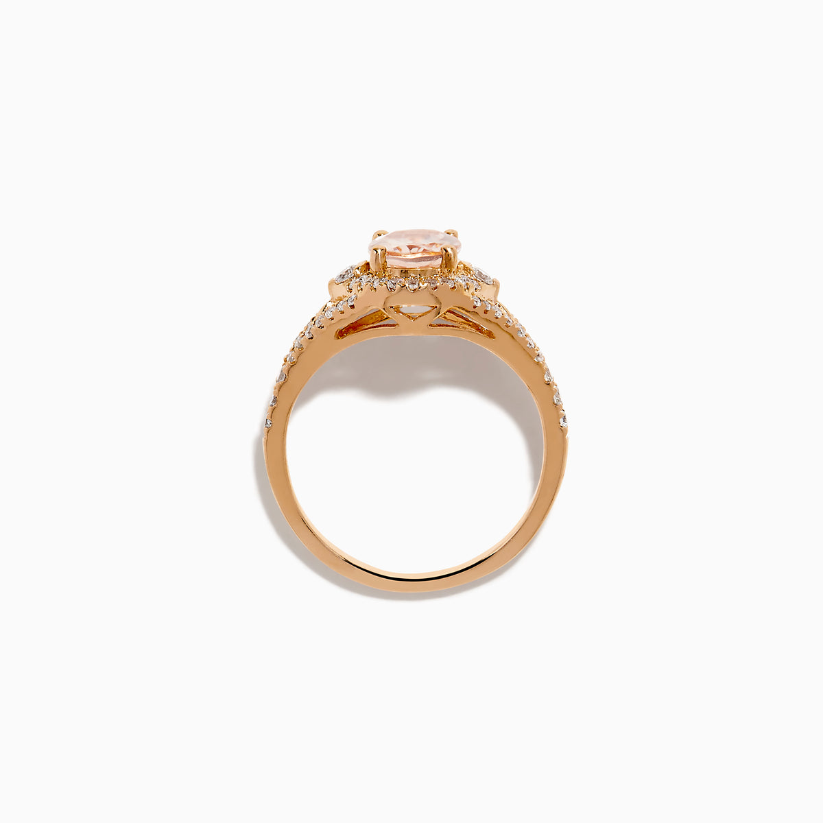 The Rose Gold Morganite and Diamond Split Halo Ring showcases an oval peach-colored Morganite center, encircled by a sparkling diamond split halo with additional diamonds along the band.