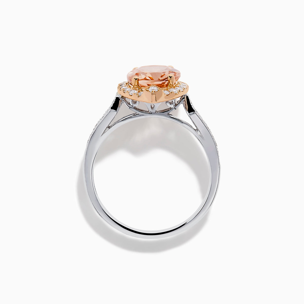 The Blush 14K Two-Tone Gold Morganite and Diamond Ring showcases a marquise-cut peach morganite with a halo of white diamonds set on an elegant gold and silver band for a unique, eye-catching look.