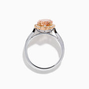 The Blush 14K Two-Tone Gold Morganite and Diamond Ring showcases a marquise-cut peach morganite with a halo of white diamonds set on an elegant gold and silver band for a unique, eye-catching look.