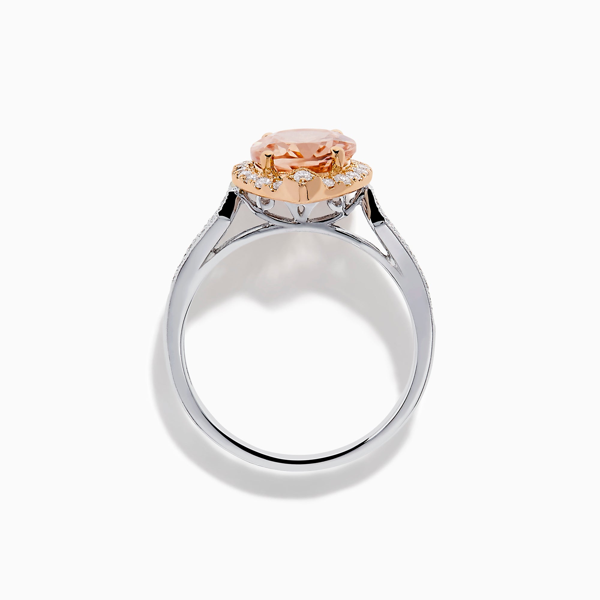 The Blush 14K Two-Tone Gold Morganite and Diamond Ring showcases a marquise-cut peach morganite with a halo of white diamonds set on an elegant gold and silver band for a unique, eye-catching look.