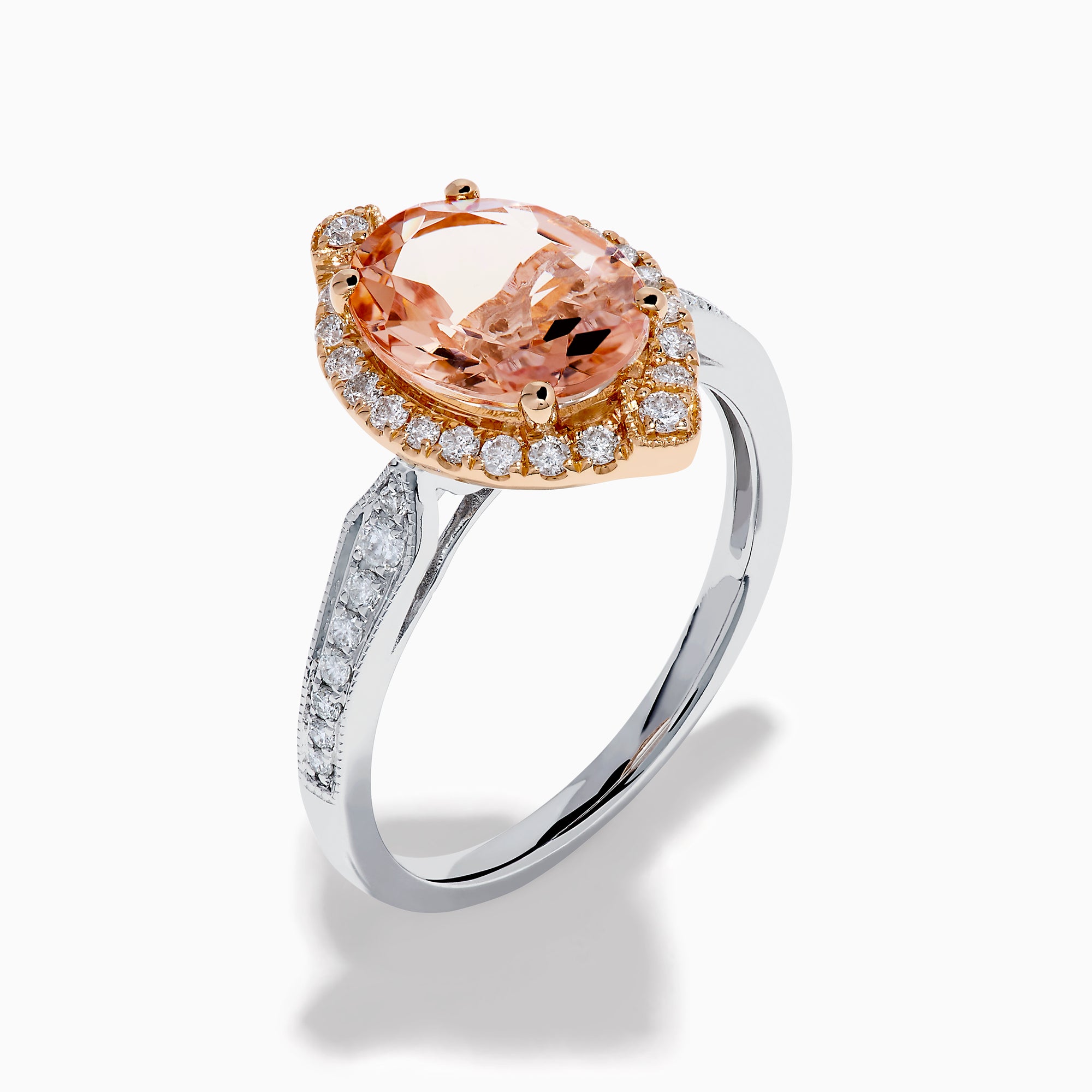 The Blush 14K Two-Tone Gold Morganite and Diamond Ring showcases a marquise-cut peach morganite with a halo of white diamonds set on an elegant gold and silver band for a unique, eye-catching look.