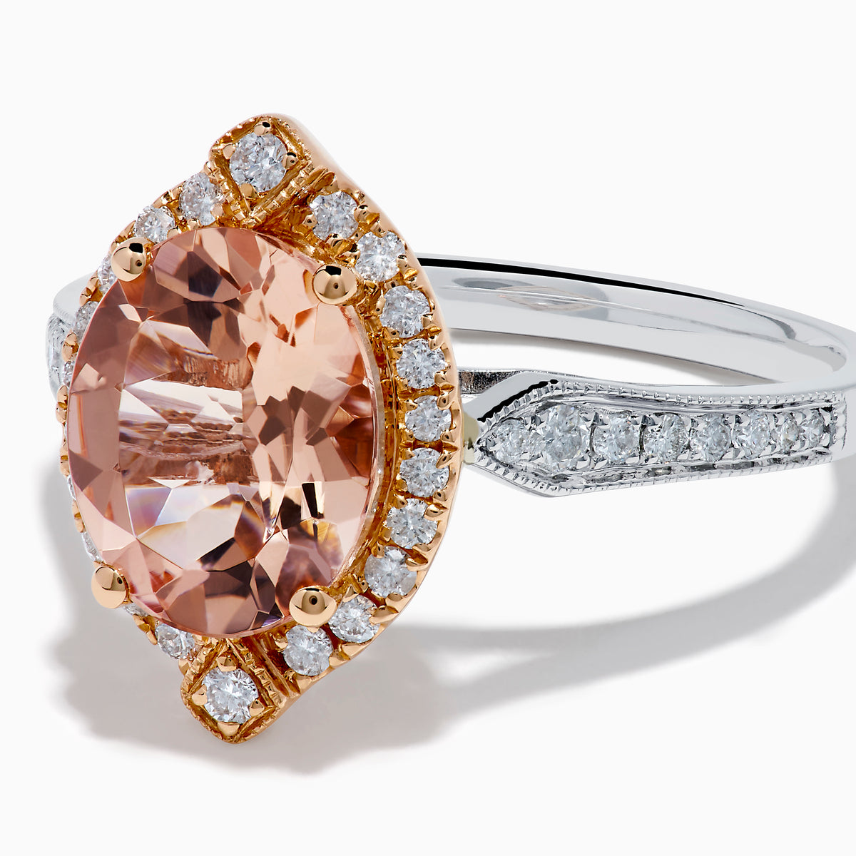 The Blush 14K Two-Tone Gold Morganite and Diamond Ring showcases a marquise-cut peach morganite with a halo of white diamonds set on an elegant gold and silver band for a unique, eye-catching look.