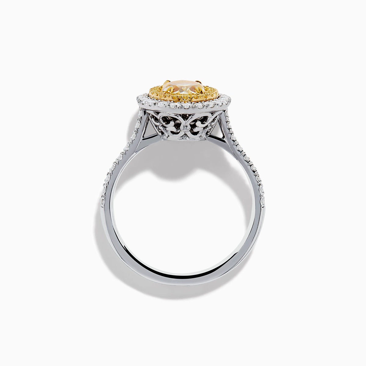 The 18K Two Tone Gold White and GIA Certified Yellow Diamond Double Halo Ring features a central oval yellow diamond, surrounded by white diamonds and additional diamonds set along the band.
