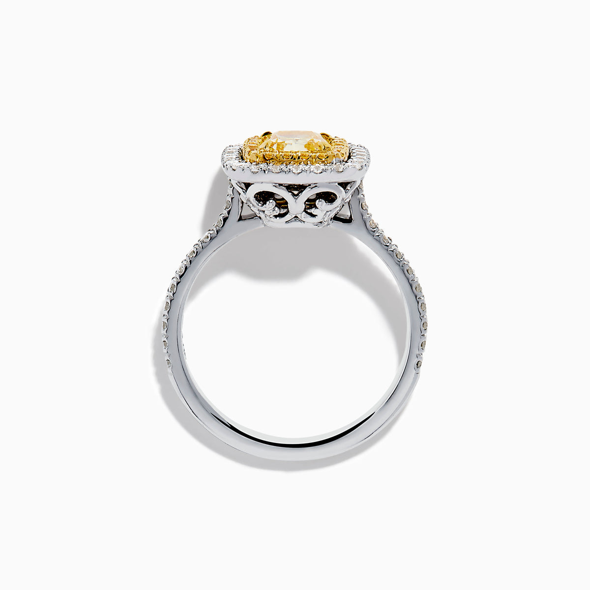 The 18K Two Toned Gold GIA certified Yellow and White Diamond Halo Ring features a rectangular yellow center stone, double halos of white diamonds, and extra diamonds along the band for exceptional brilliance.