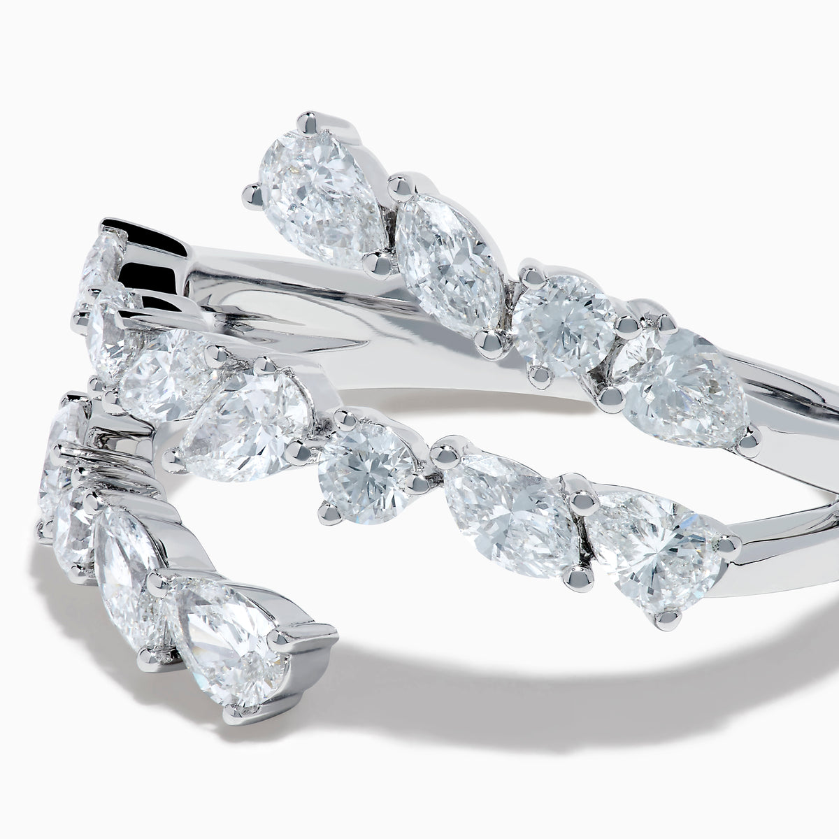 The Lab Grown Multi Shaped Diamond 1.23ct Wrap Ring in 14K White Gold features pear and round lab grown diamonds in a leaf-inspired, open front design, shown against a white background.