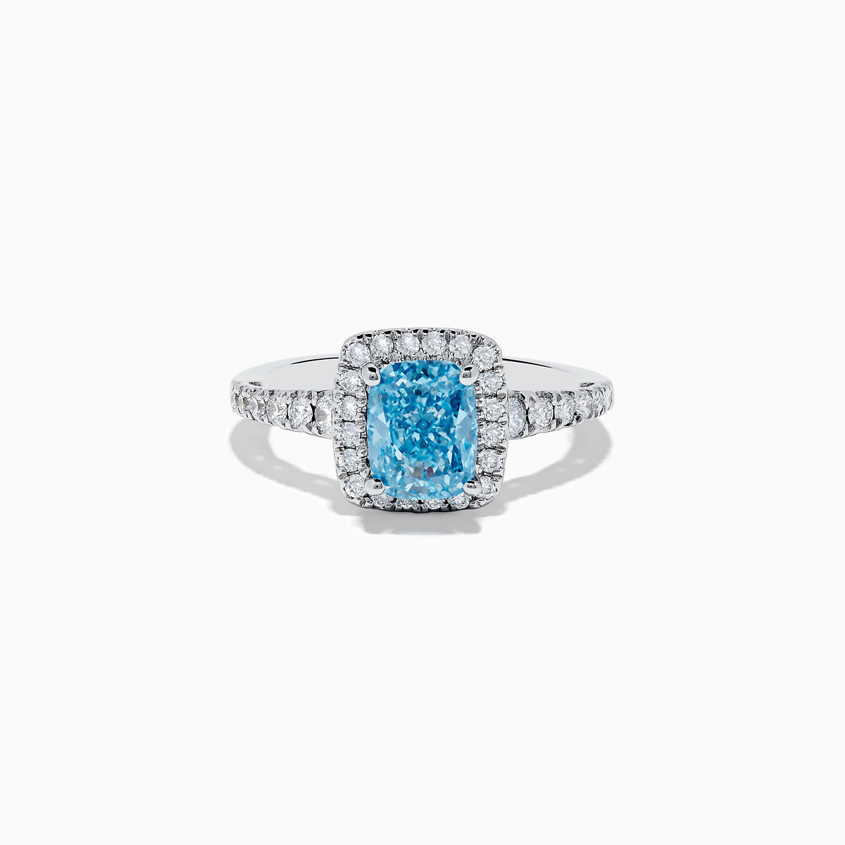 The 14K White Gold Lab Grown Blue and White Diamond Ring showcases a rectangular blue gemstone at its center, encircled by a halo of lab grown diamonds and more diamonds set along the band for extra sparkle.