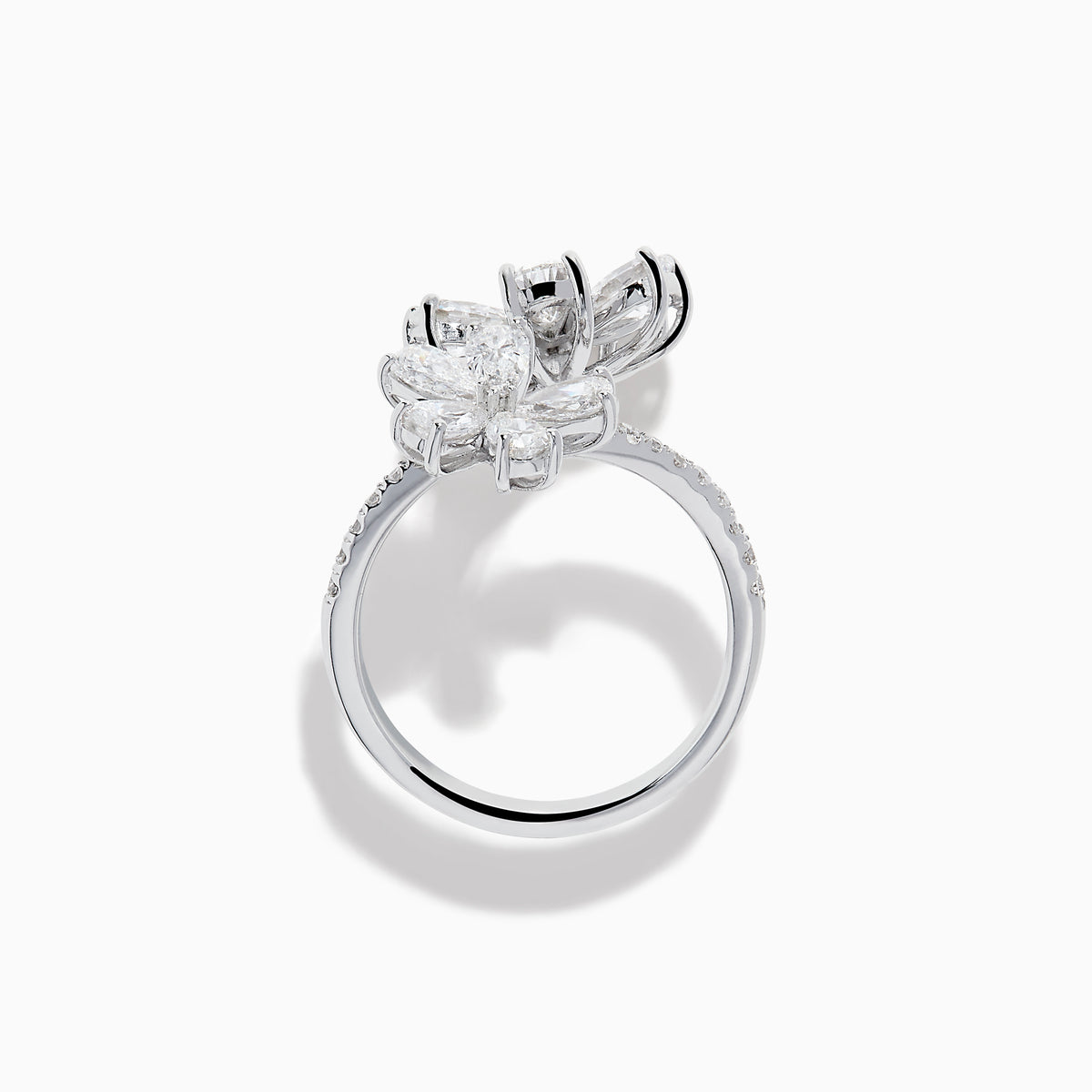 The Lab Grown Pear and Round Diamond 2.75ct Flower Bypass Ring in 14K White Gold features two flower designs with pear-shaped and round diamonds on a partially encrusted band, set against a white background for an elegant look.