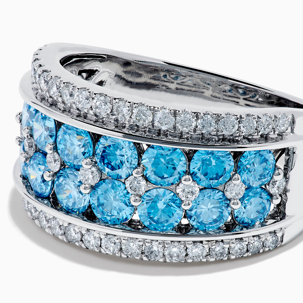 The Lab Grown Blue and White Diamond Statement Ring in 14K White Gold showcases rows of vivid blue gems bordered by sparkling lab grown diamonds for an elegant, standout look.