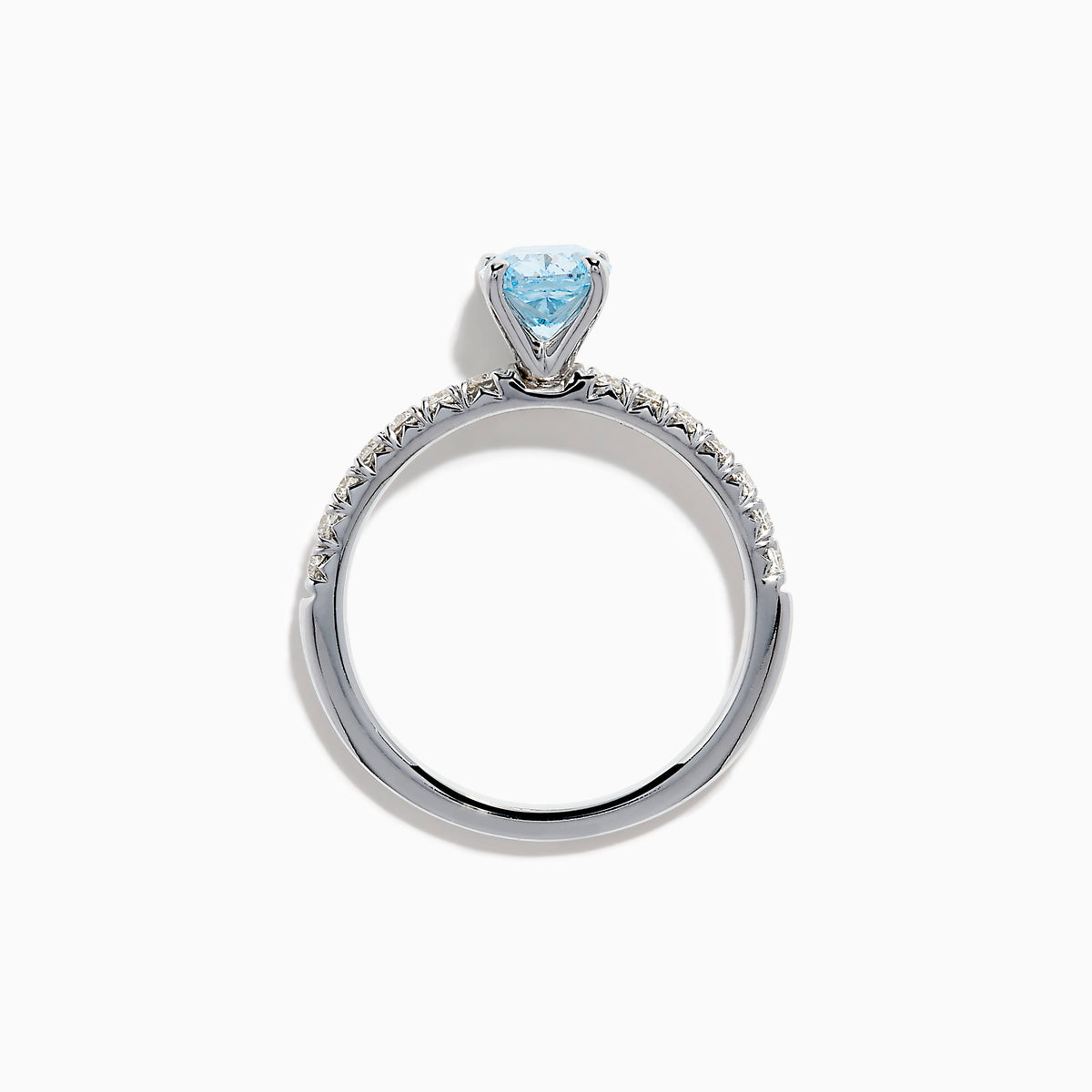 The Lab Grown Blue Diamond Solitaire Cushion Ring in 14K White Gold features a rectangular lab grown blue diamond at the center, accented with small clear round stones along the band.