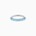 The Lab Grown Blue Diamond Emerald Cut Stacking Band in 14K White Gold features a row of emerald cut lab-grown blue diamonds set along the band, displayed on a plain white background.