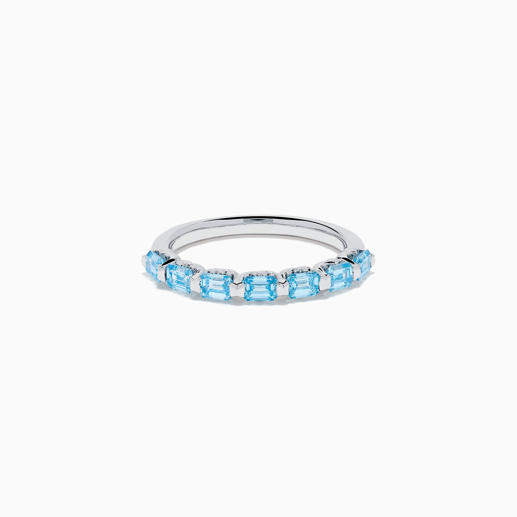 The Lab Grown Blue Diamond Emerald Cut Stacking Band in 14K White Gold features a row of emerald cut lab-grown blue diamonds set along the band, displayed on a plain white background.