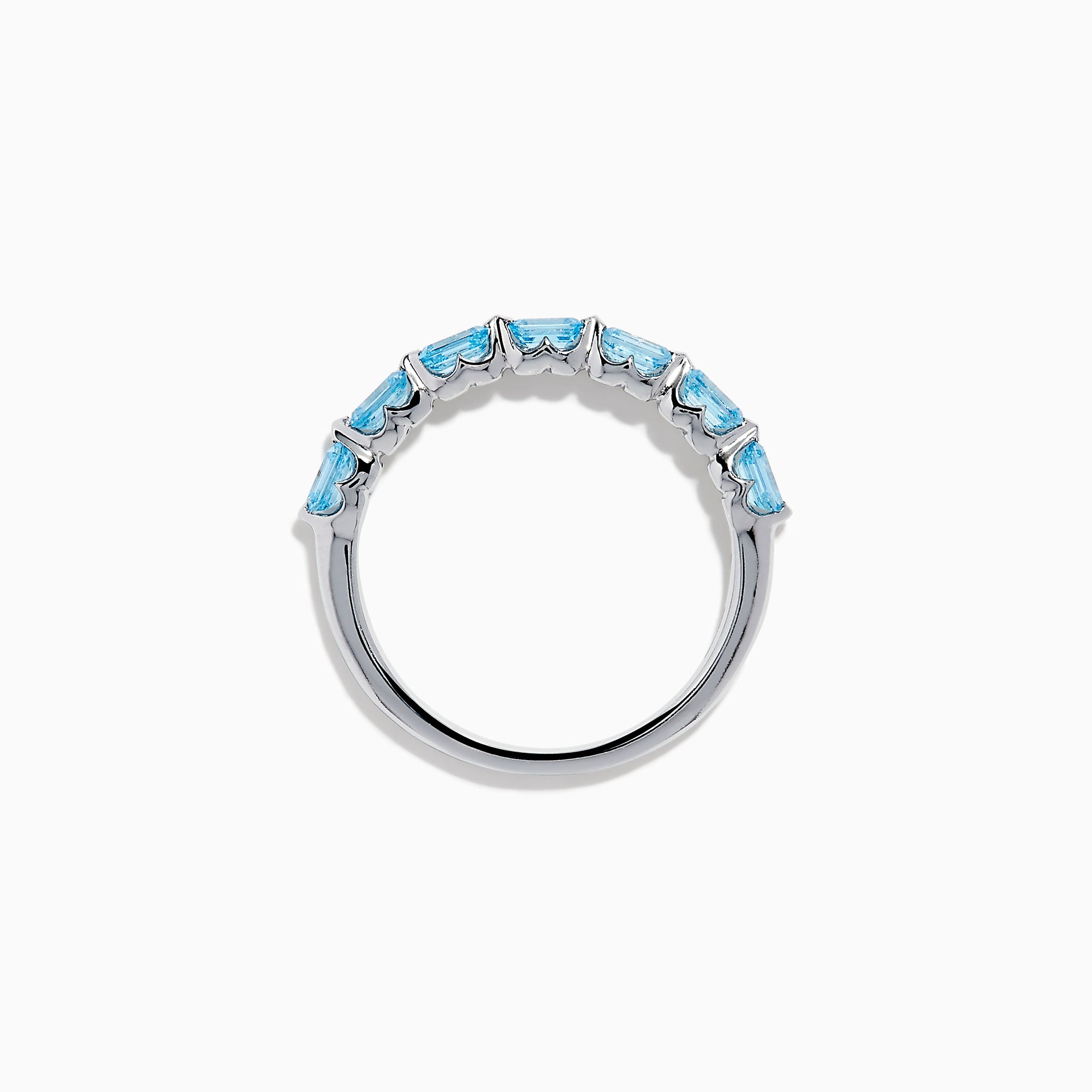 The Lab Grown Blue Diamond Emerald Cut Stacking Band in 14K White Gold features a row of emerald cut lab-grown blue diamonds set along the band, displayed on a plain white background.