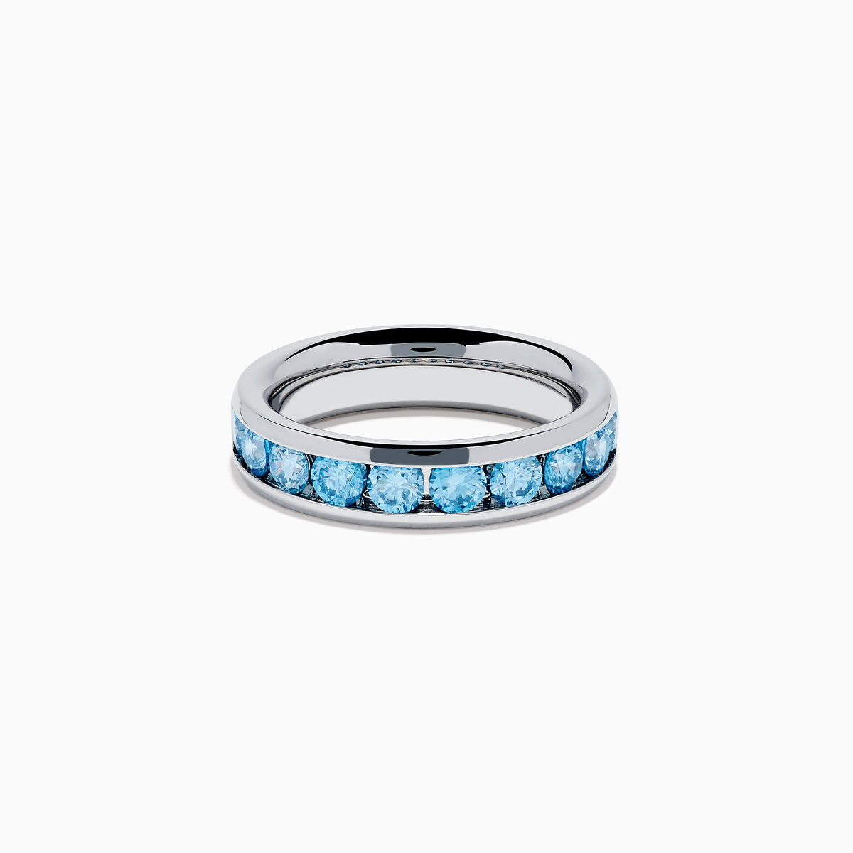 The Lab Grown Blue Diamond Channel Set Band in 14K White Gold features a row of round blue diamonds encircling the band, shown elegantly on a plain white background.