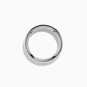 The Lab Grown Blue Diamond Channel Set Band in 14K White Gold features a row of round blue diamonds encircling the band, shown elegantly on a plain white background.