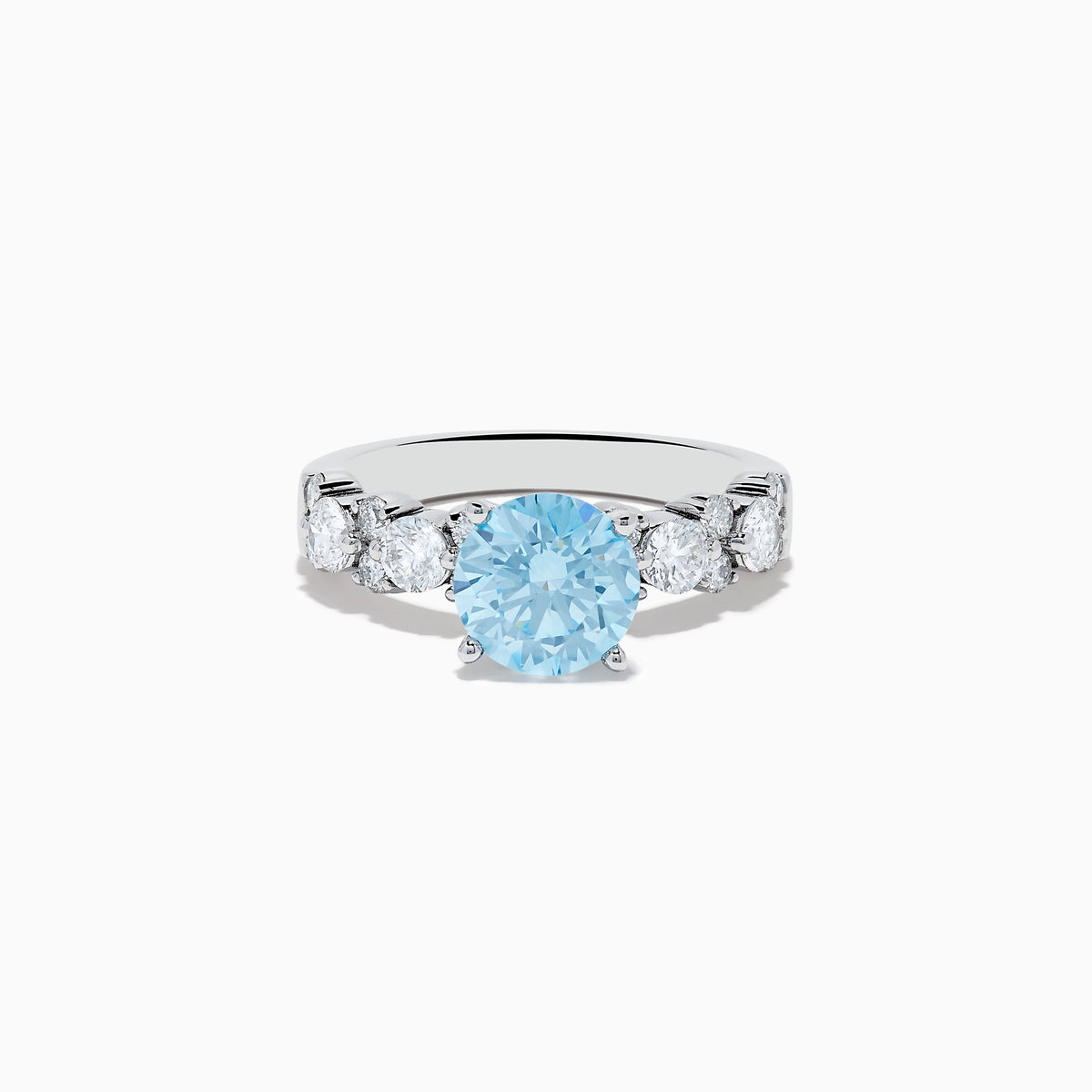 The 14K White Gold Lab Grown Blue and White Diamond Ring features a large round blue gemstone in the center, flanked by three smaller lab grown diamonds on each side, set against a plain white background.