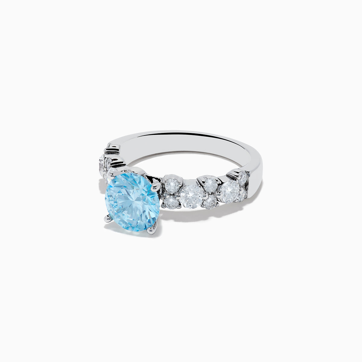 The 14K White Gold Lab Grown Blue and White Diamond Ring features a large round blue gemstone in the center, flanked by three smaller lab grown diamonds on each side, set against a plain white background.