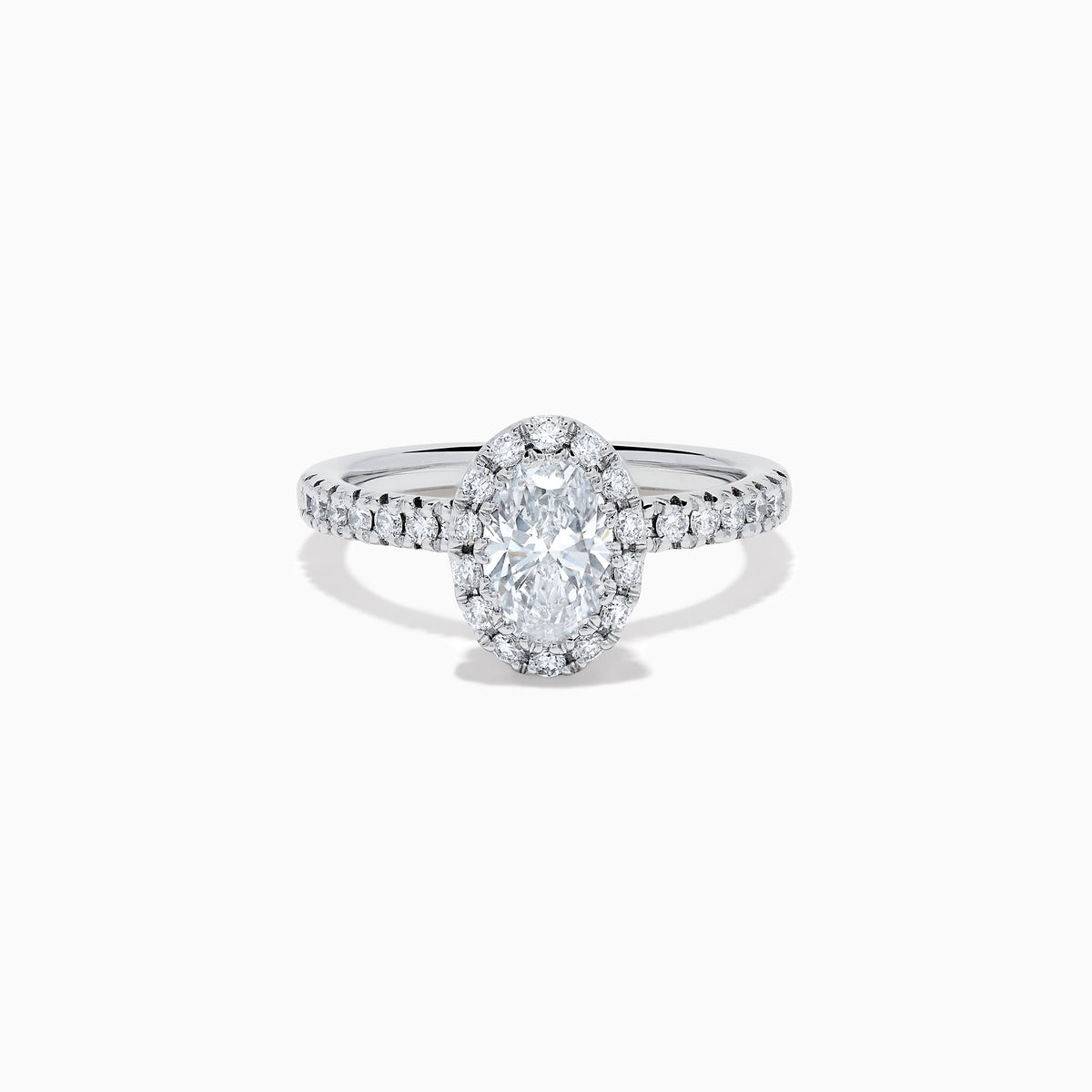The Lab Grown Oval Diamond Halo and Hidden Halo Ring in 14K White Gold showcases an oval lab grown diamond center, a sparkling diamond halo, hidden halo accents, and additional diamonds along the band.