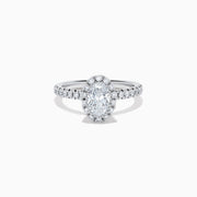 The Lab Grown Oval Diamond Halo and Hidden Halo Ring in 14K White Gold showcases an oval lab grown diamond center, a sparkling diamond halo, hidden halo accents, and additional diamonds along the band.