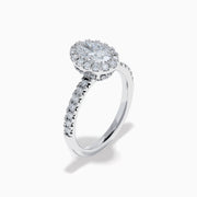 The Lab Grown Oval Diamond Halo and Hidden Halo Ring in 14K White Gold showcases an oval lab grown diamond center, a sparkling diamond halo, hidden halo accents, and additional diamonds along the band.
