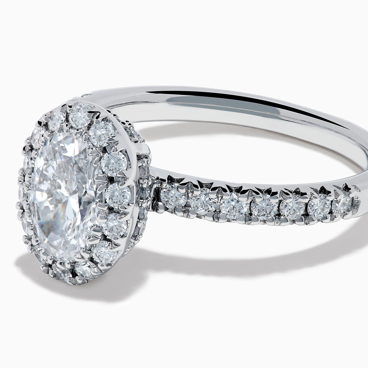 The Lab Grown Oval Diamond Halo and Hidden Halo Ring in 14K White Gold showcases an oval lab grown diamond center, a sparkling diamond halo, hidden halo accents, and additional diamonds along the band.