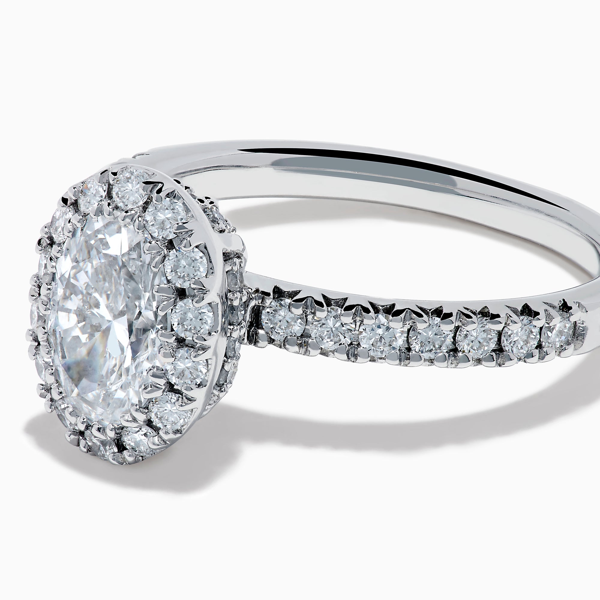 The Lab Grown Oval Diamond Halo and Hidden Halo Ring in 14K White Gold showcases an oval lab grown diamond center, a sparkling diamond halo, hidden halo accents, and additional diamonds along the band.
