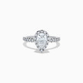 The Lab Grown Pear Diamond Halo and Hidden Halo Ring in 14K White Gold features a lab-grown pear center, a surrounding halo and hidden halo of diamonds on a white gold band, shown against a plain white background.