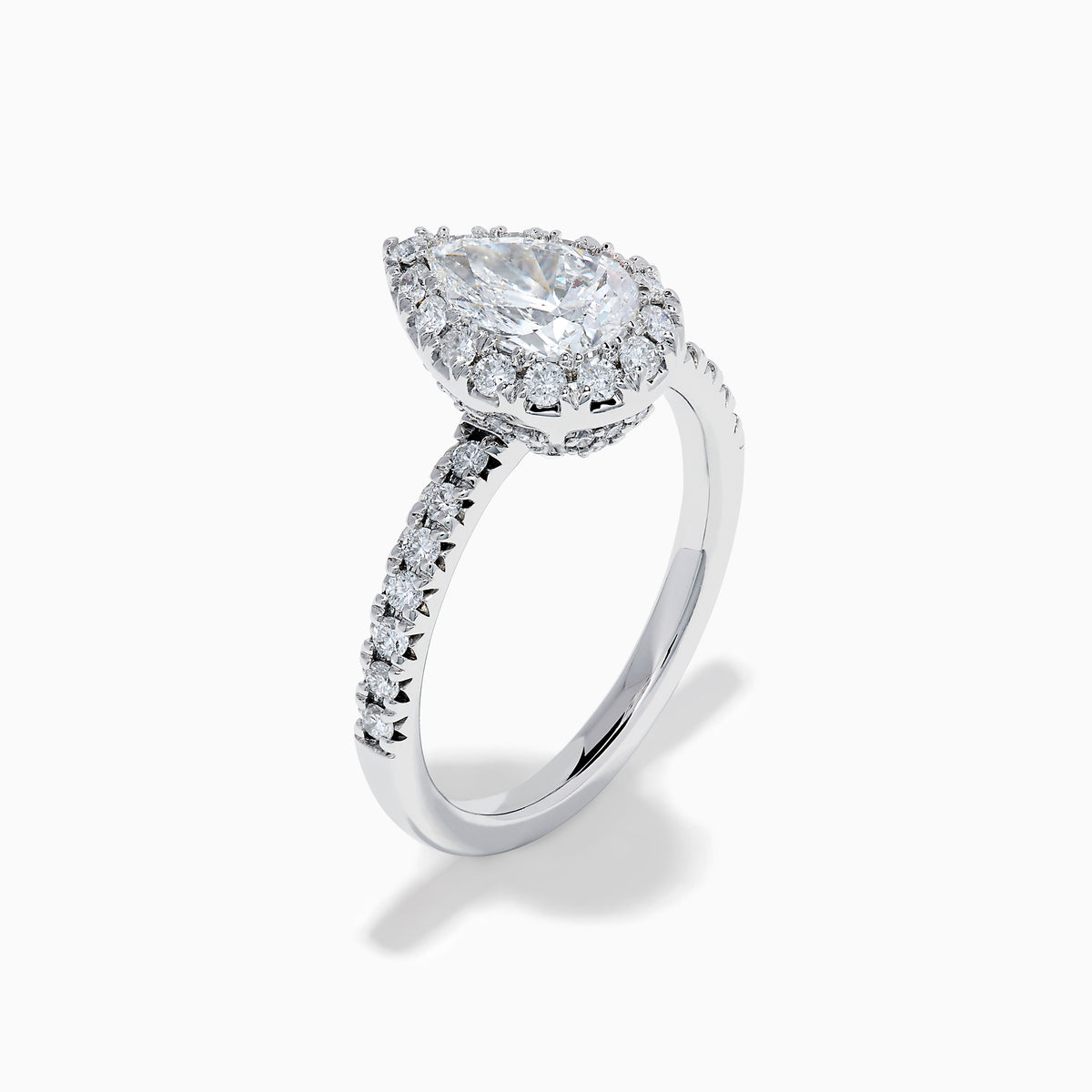 The Lab Grown Pear Diamond Halo and Hidden Halo Ring in 14K White Gold features a lab-grown pear center, a surrounding halo and hidden halo of diamonds on a white gold band, shown against a plain white background.
