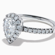The Lab Grown Pear Diamond Halo and Hidden Halo Ring in 14K White Gold features a lab-grown pear center, a surrounding halo and hidden halo of diamonds on a white gold band, shown against a plain white background.
