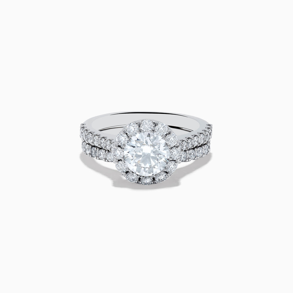 The 14K White Gold Lab Grown Diamond Ring and Band Set features a large round lab grown diamond, surrounded by smaller diamonds on a split shank band encrusted with more diamonds, all shown against a white background.