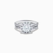 The 14K White Gold Lab Grown Diamond Ring and Band Set features a large round lab grown diamond, surrounded by smaller diamonds on a split shank band encrusted with more diamonds, all shown against a white background.