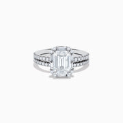 The 14K White Gold Lab Grown Diamond Ring and Band Set features a striking emerald-cut center diamond with round diamonds along the split shank band, shown on a plain white background.
