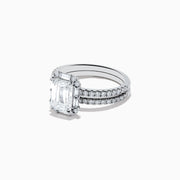 The 14K White Gold Lab Grown Diamond Ring and Band Set features a striking emerald-cut center diamond with round diamonds along the split shank band, shown on a plain white background.