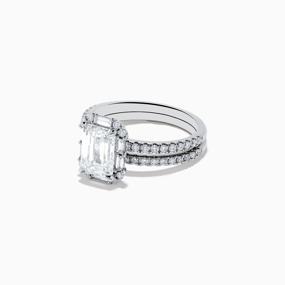 The 14K White Gold Lab Grown Diamond Ring and Band Set features a striking emerald-cut center diamond with round diamonds along the split shank band, shown on a plain white background.