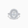 The Lab Grown Oval Diamond Double Halo Ring in 14K White Gold features a dazzling oval center, lab grown diamonds in a double halo, and extra sparkle along the band for an elegant look.
